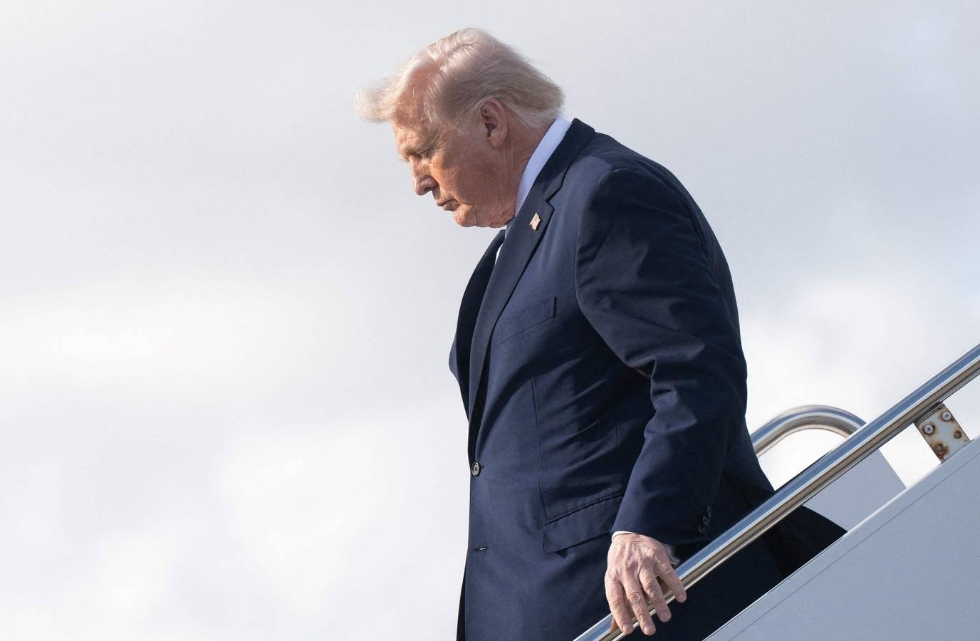 Trump's Struggle Down Air Force One Stairs Sparks Fresh Health Concerns